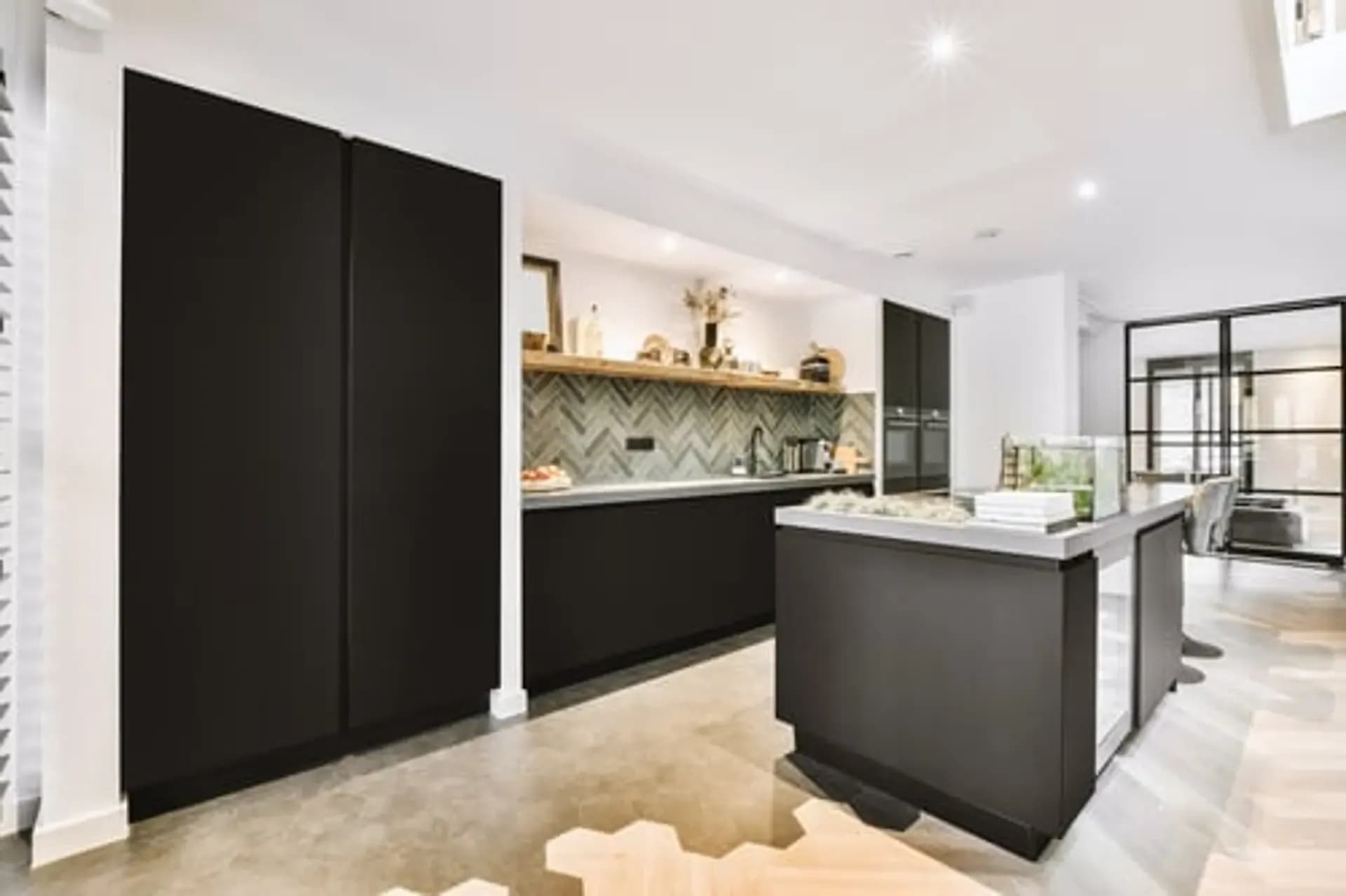Completed high-end kitchen renovation showing the finish standard Unlimited Services LLC works to