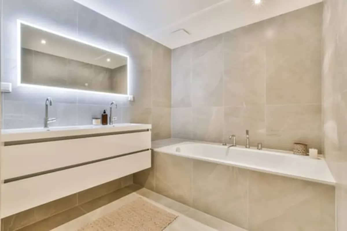 Modern bathroom remodel with freestanding tub, glass shower and large-format tile in Stamford, CT