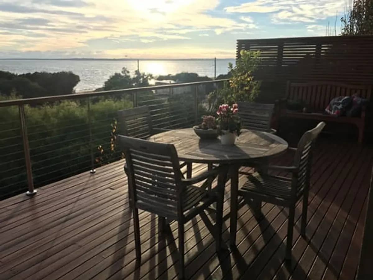 Custom outdoor deck with railing and seating overlooking the Connecticut shoreline