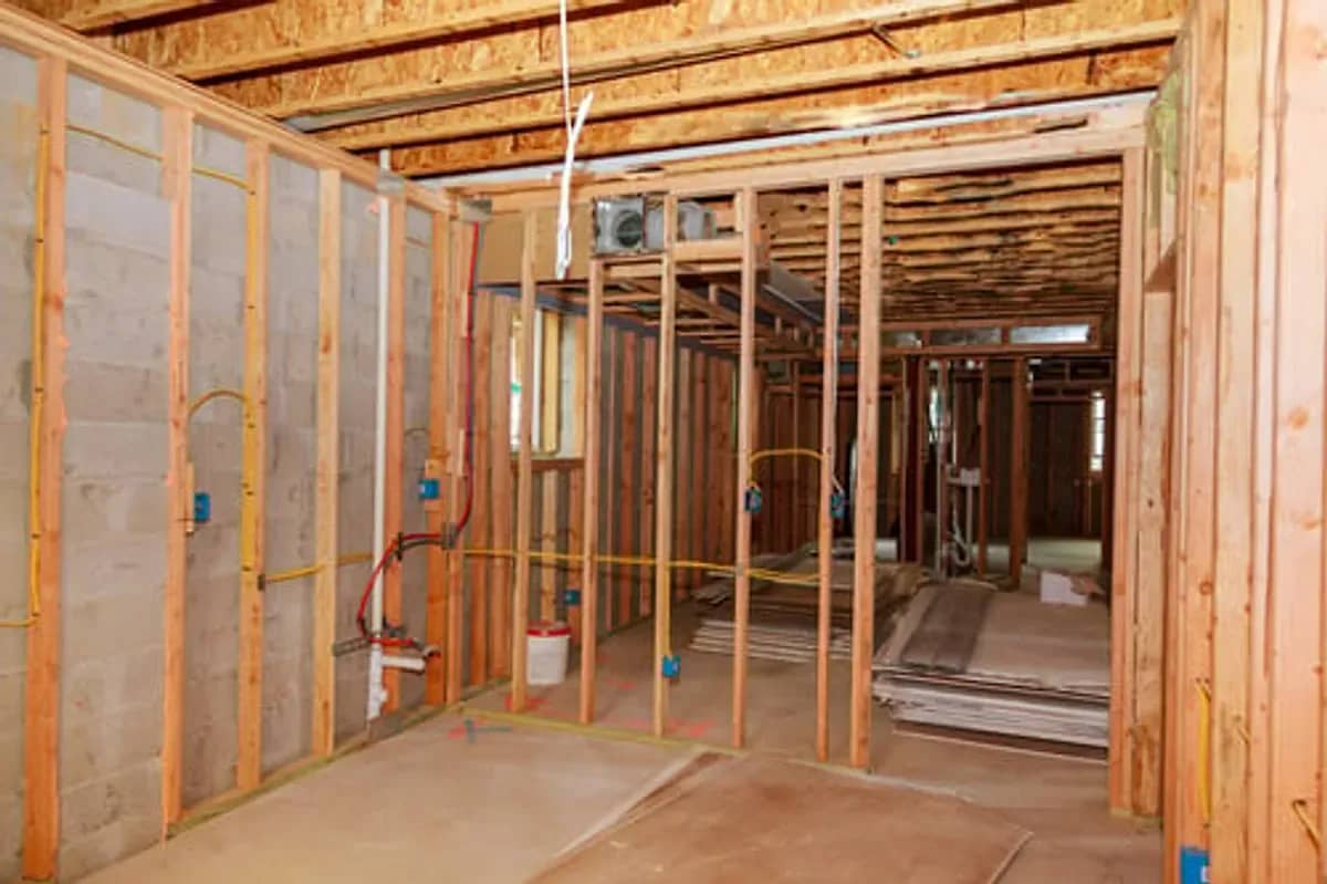 Basement finishing project showing new framing and mechanical rough-ins in a Connecticut home