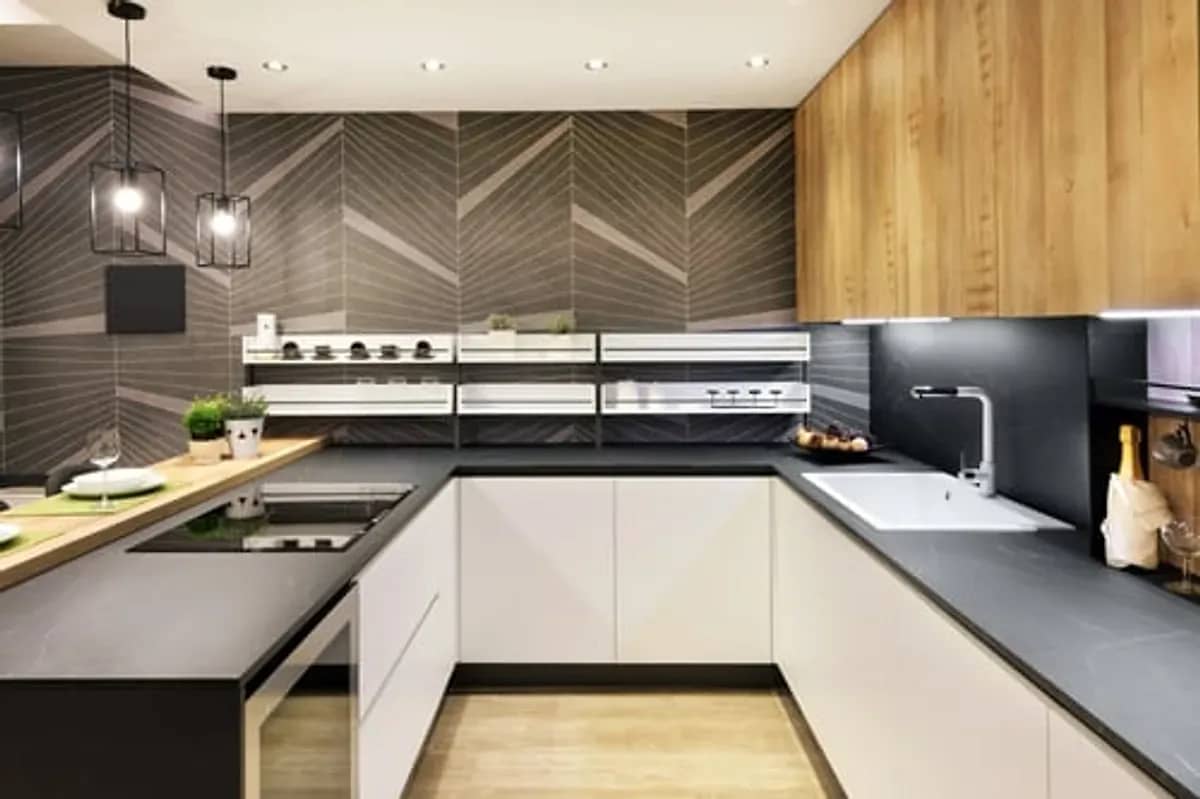 Modern remodeled kitchen with dark cabinetry and wood accents in Fairfield County, Connecticut