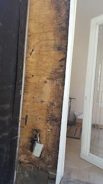 Wall opened for structural and water damage repair during a home renovation in Stamford, CT