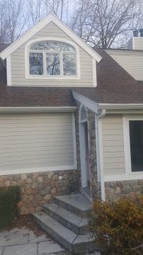 New architectural shingle roof, siding and stone entry steps on a Fairfield County CT home